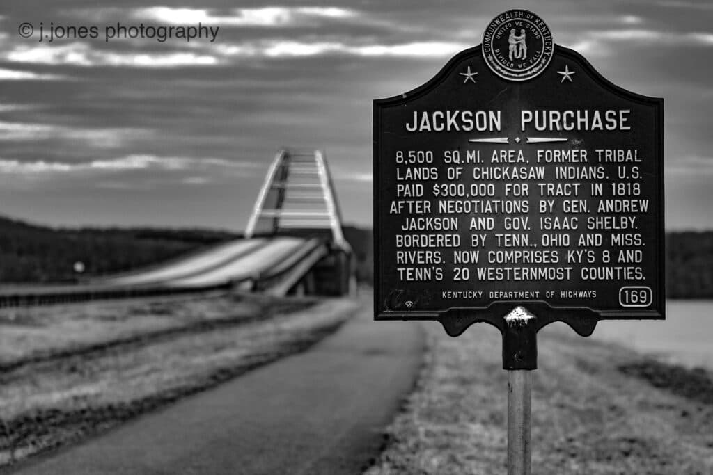 photo of the Eggners ferry bridge with the jackson purchase historical sign in the foreground photo of the Eggners ferry bridge with the jackson purchase historical sign in the foreground